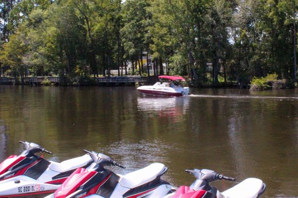 A little boat out on the riverfront of Island Adventure Watersports